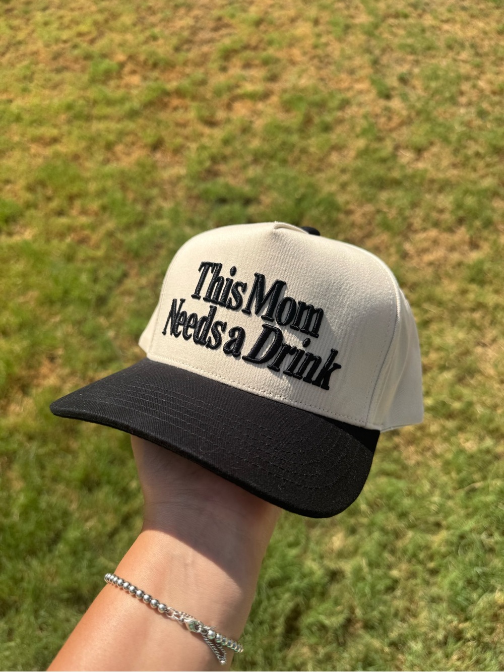 This mom needs a drink boutique trucker hat